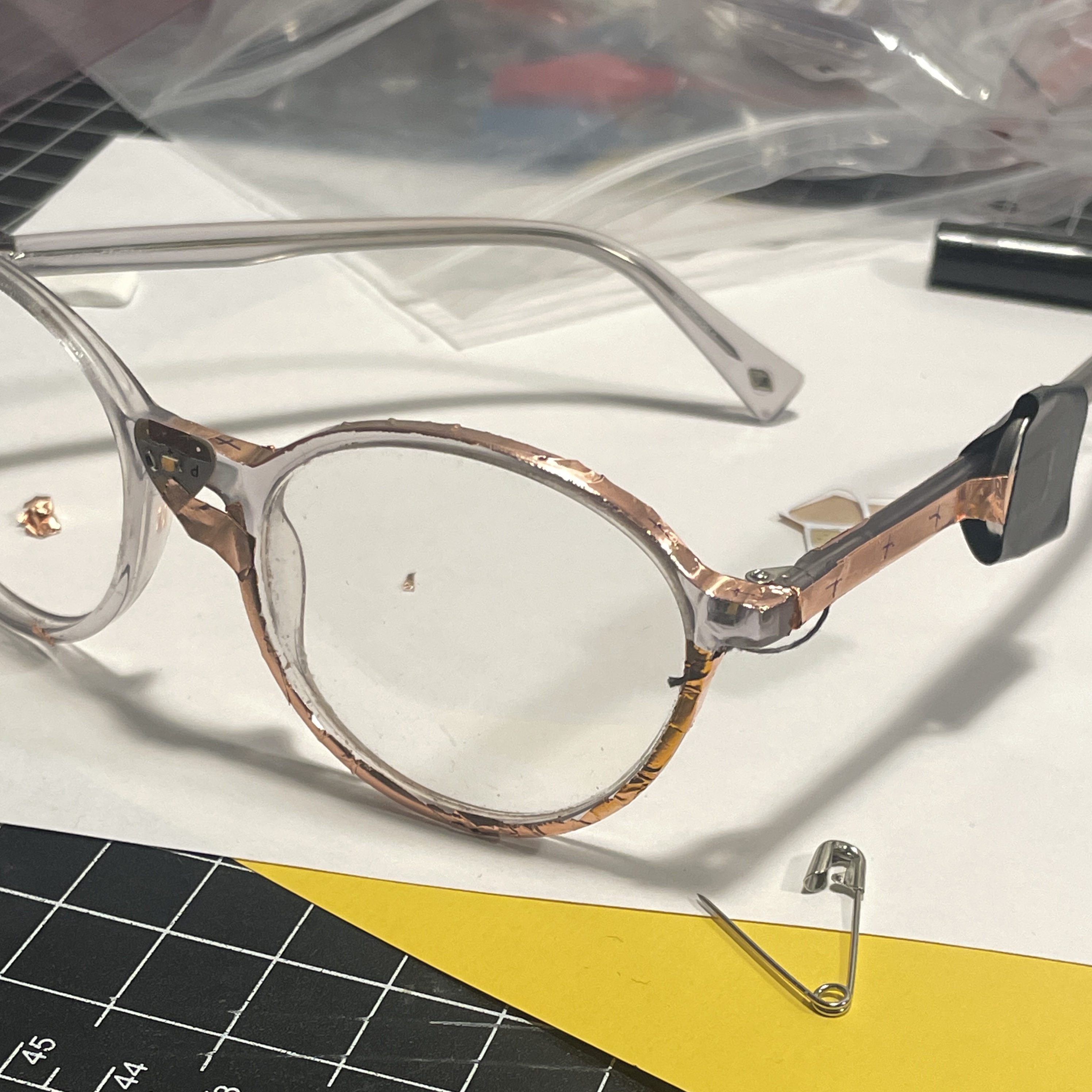 I used the hinge as the affordance over the touch between the frame and my face,
    i felt it was more consistent. The connection when the hinge opened was a bit glitchy but I fixed it by reinforcing the layers of copper tape. I also had to use the
    conductive thread at the hinge as the tape was mot malleable enough to stay flexible around the hinge.<a href='https://youtu.be/TlnEHU4nME4' target='_blank'><p>Glasses Video</p></a>